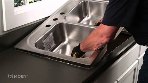 installing stainless steel sink to granite with cabinet brackets|attaching stainless steel under sink to granite.